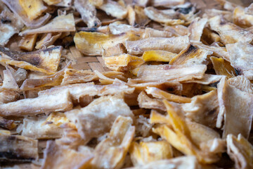 Dried cassava pieces after drying in the hot sun. Traditional Indonesian food made from cassava.