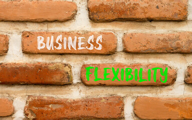 Business flexibility symbol. Concept words Business flexibility on beautiful brick wall. Beautiful...