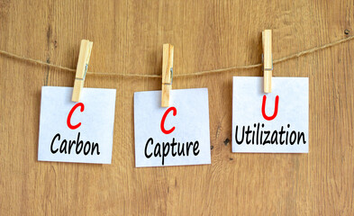CCU Carbon capture utilization symbol. Concept words CCU Carbon capture utilization on beautiful paper. Beautiful wooden background. Business ecological Carbon capture utilization concept. Copy space.