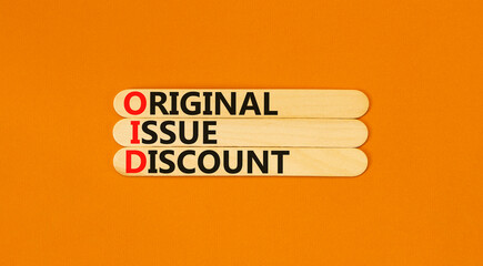 OID original issue discount symbol. Concept words OID original issue discount on beautiful wooden stick. Beautiful orange background. Business OID original issue discount concept. Copy space.