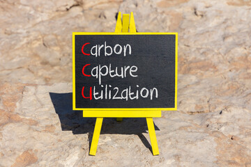 Fototapeta premium CCU Carbon capture utilization symbol. Concept words CCU Carbon capture utilization on beautiful blackboard Beautiful stone background Business ecological Carbon capture utilization concept Copy space