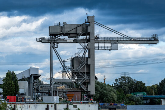 Hamburg, Germany - 08 31 2023: View of the crane for unloading the coal ships at the Tiefstack thermal power plant in Hamburg