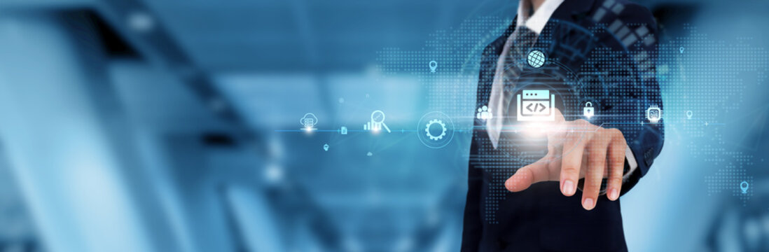 Web Development: Businessman touching the Web Development icon and global technological Networking. Coding, Designing, Enhancing User Experience.