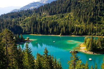 Aerial view of idyllic Lake Caumasee at mountain village of Flims in the Swiss Alps on sunny summer day. Photo taken August 12th, 2007, Flims, Switzerland.