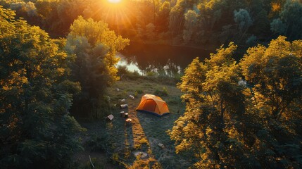 Set up a camping tent at sunset