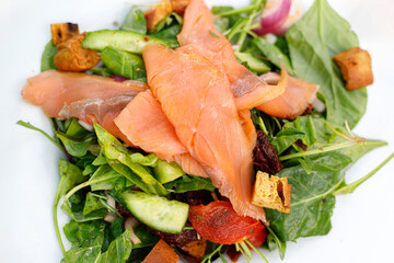 Smoked salmon, lettuce, cherry, cucumber, roasted pepper, fresh mushrooms, croutons and tomatoes. Selective Focus