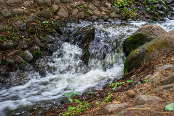 small artificial waterfall in the park.