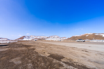 The journey from Isfahan to Tehran in March offers views of snow-capped hills at an altitude of 2,100 meters. Tehran, Iran.