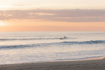 surfers at sunrise