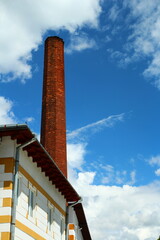 Fototapeta premium A tall chimney on a building