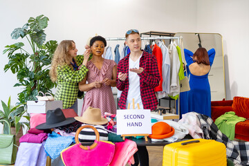 second hand store, saving money and family budget, young people students at swap party try on clothes, bags, shoes and accessories, change clothes with each other, second hand for things, zero waste