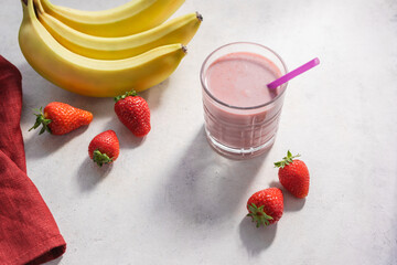 Strawberry and banana smoothie drink, blended cocktail, milkshake in a glass