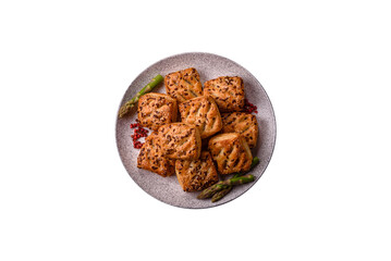 Triangular puffs with feta cheese, tomatoes with salt, spices and herbs