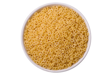 Raw anellini pasta from durum wheat with salt and spices