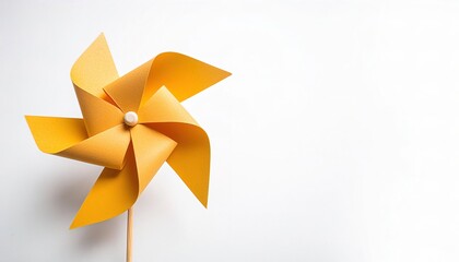 pinwheel or windmill paper origami isolated on white background simple starter craft for kids for weekend entertainment. ESG and Clean Energy Concept. Wind Turbine Paper into the Sky. Decrease Carbon