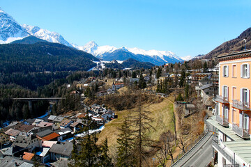 Aerial view of Swiss mountain village of Scuol in the Swiss Alps with scenic landscape on a sunny...