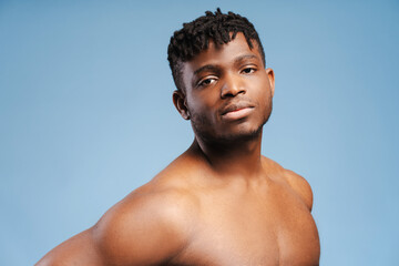 Handsome, sexy, attractive African American shirtless man looking at camera