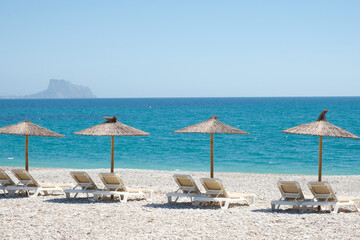 View to turquoise blue Mediterranean Sea and Albir seaside beach in Alicante province, Spain. Raco...