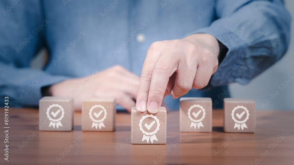 Poster a person is placing a wooden block with a certificate checkmark icon on it in concept of certified p