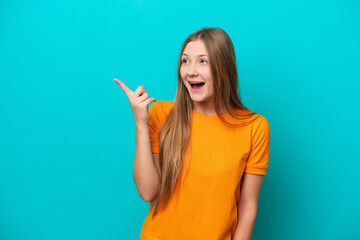 Young Russian woman isolated on blue background intending to realizes the solution while lifting a...