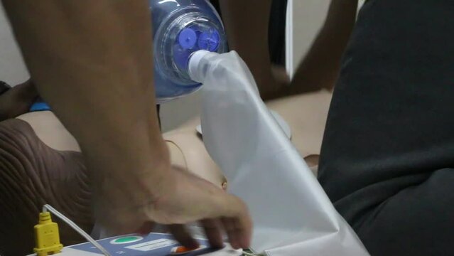 Emergency and first aid class on cpr doll, Cardiac life support