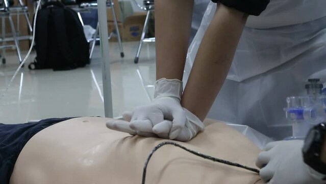 Emergency and first aid class on cpr doll, Cardiac life support