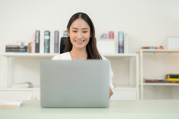 Focused woman working at home office