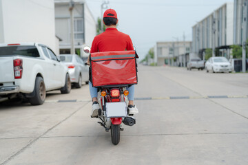 Delivery rider on motorbike in urban setting