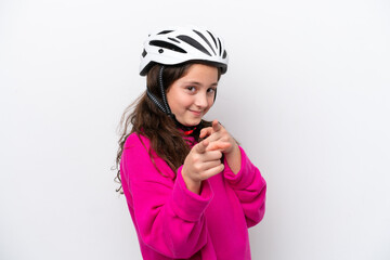 Little cyclist girl isolated on white background points finger at you with a confident expression