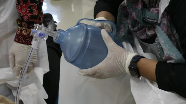 Emergency and first aid class on cpr doll, Cardiac life support