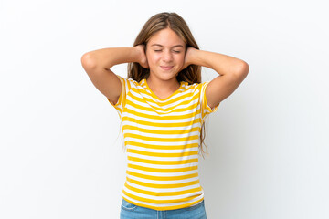 Little caucasian girl isolated on white background frustrated and covering ears