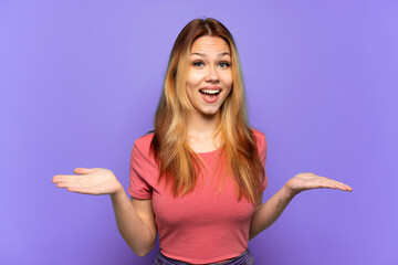 Teenager girl over isolated purple background with shocked facial expression