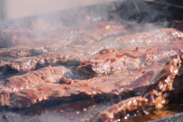 Tempting Platter: Steaming and Juicy Meat on an Iron Skillet