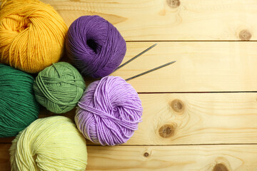 Colorful knitting yarn balls on table