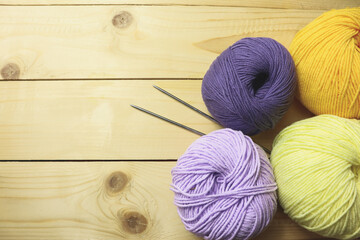 Colorful knitting yarn balls on table