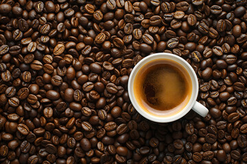Fototapeta premium Freshly Brewed Coffee in a Black Cup Surrounded by Coffee Beans