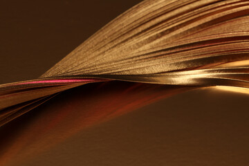 Abstract glow backgound. Gold (bronze) paper wave line on brown reflection light and shadow...