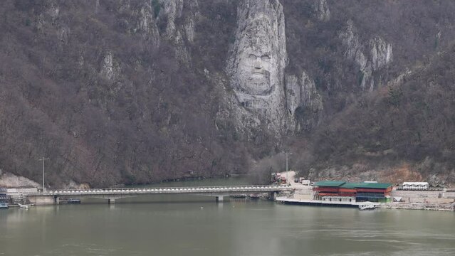 Giant Rock Sculpture of Decebalus Last King of Dacia Face Carving in Stone at River Danube Coast Dubova Romania