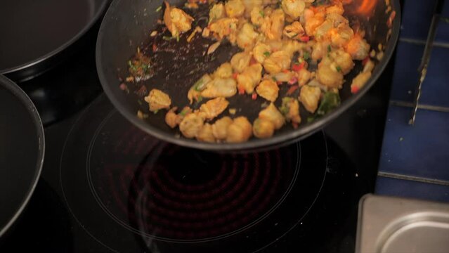 Flamb&eacute; shrimps being cook in pan (Caribbean)
