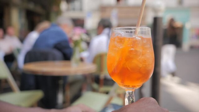 Orange cocktail on a typical parisian terrace (Paris, France)