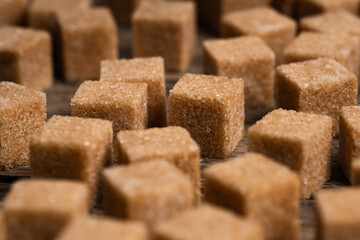 Cubes of refined cane sugar in closeup.