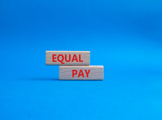 Equal Pay symbol. Wooden blocks with words Equal Pay. Beautiful blue background. Business and Equal Pay concept. Copy space.
