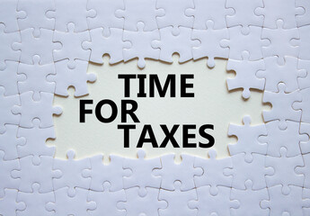 Time for Taxes symbol. Concept words Time for Taxes on white puzzle. Beautiful white background with succulent plant. Business and Time for Taxes concept. Copy space.