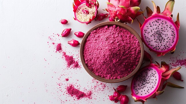 Vibrant dragon fruit powder in a rustic bowl, scattered petals, and seeds on a white textured surface. Minimalistic composition with ample copyspace, perfect for health or food-related designs.
