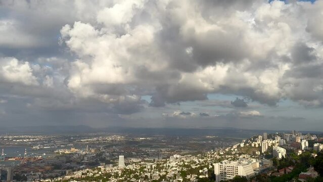 Haifa, Israel, June 26, 2022 : view from the Louis Promenade on Mount Carmel to the Bahai Temple, the downtown and port of Haifa city in Israel