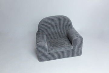 gray soft chair with a striped pattern. small sofa for dolls. pet bed for dogs and cats