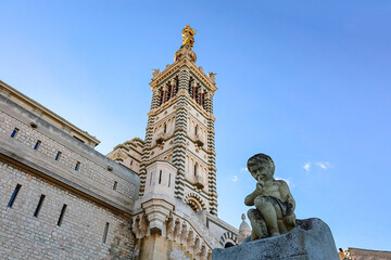 View of Notre Dame de la Garde on top of hill in Marseille. Basilica of Our Lady of Guard with morning rays of sun, Marseille, France. High quality photo