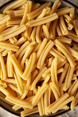 Dry Casarecce Pasta in a Bowl, top view. Close-up.