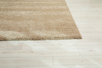 Soft beige carpet on white laminated floor indoors, space for text