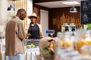 Eco-conscious African American customer inquires about organic, locally sourced fruits and...